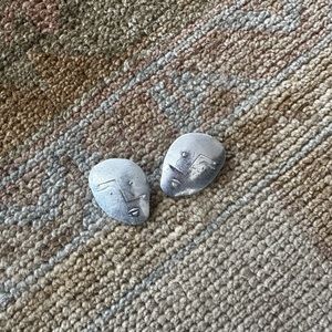 Mango face metal earrings